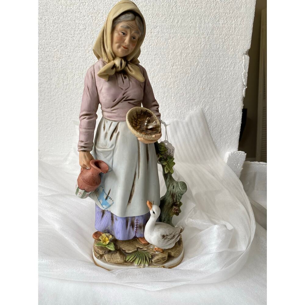 vintage Homco collections figurine featuring an elderly woman with a goose